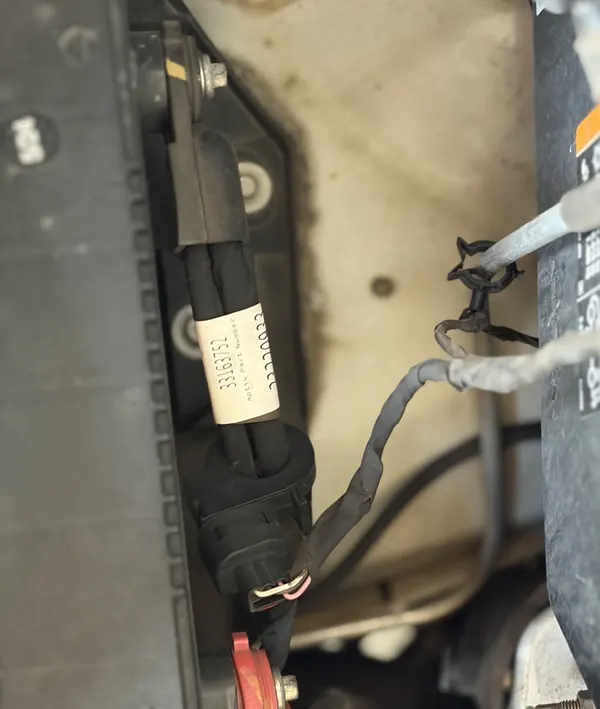 Battery cable ends, the positive one under a red cover