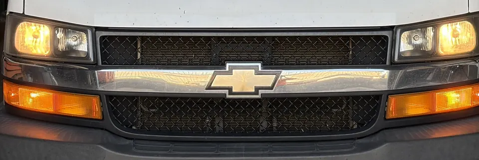 Front of the truck with the headlights and the amber front lights on