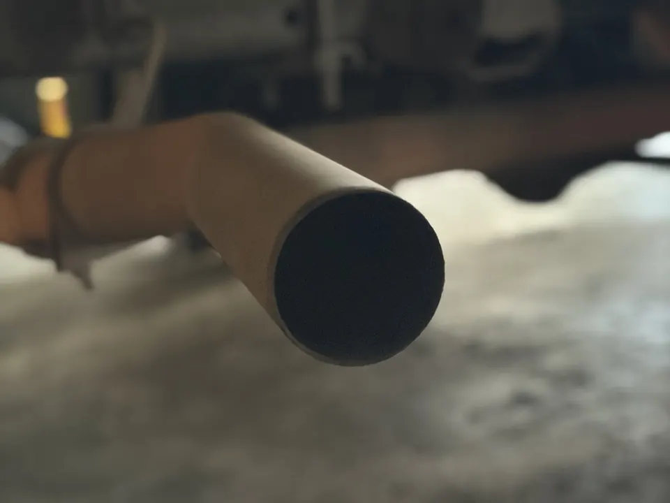 The end of the tailpipe under the truck